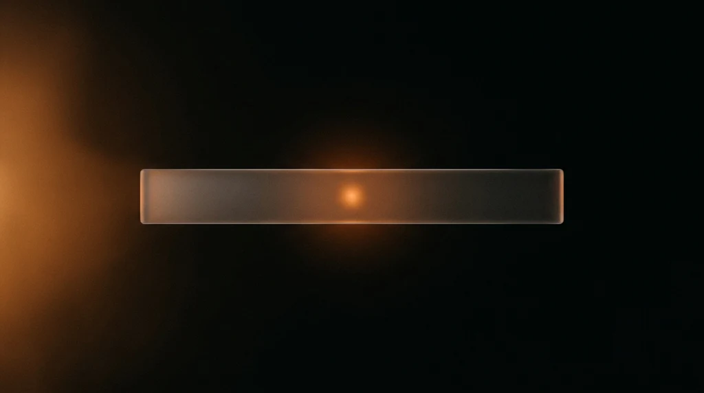 A single long horizontal bar of frosted glass floating in a near-black void, lit from behind by one small warm orange point of light.