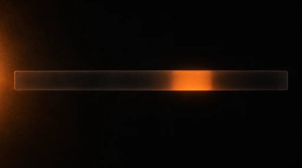 A long frosted glass bar crossing a dark frame, unlit along most of its length with one section glowing warm orange from within